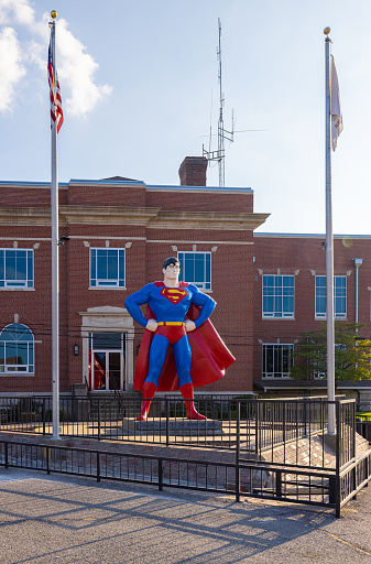 Metropolis, Illinois, USA - August 24, 2021: The Historic  Massac County Courthouse with a statue of Superman