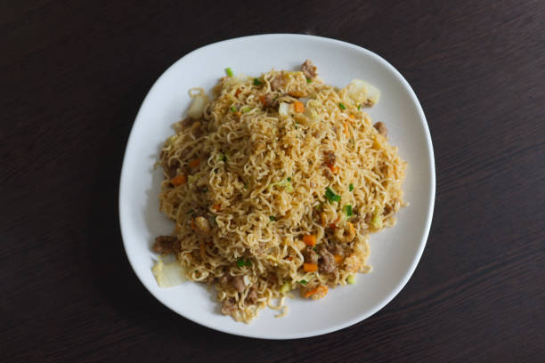 istock Fried instant noodle with carrot  and pork 1354346281
