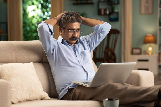 istock mature man working from home stock photo 1354358164