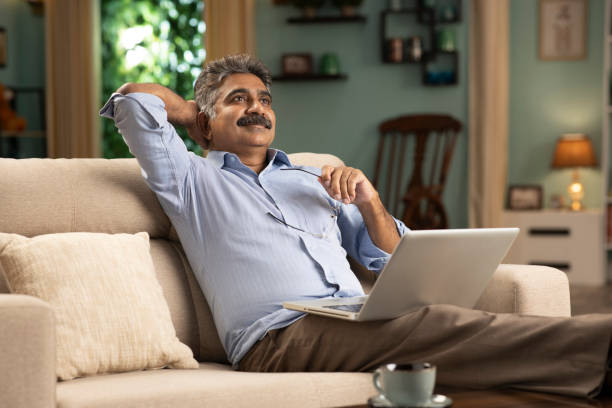 istock mature man working from home stock photo 1354358194