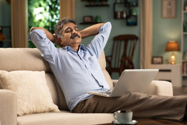 istock mature man working from home stock photo 1354358208