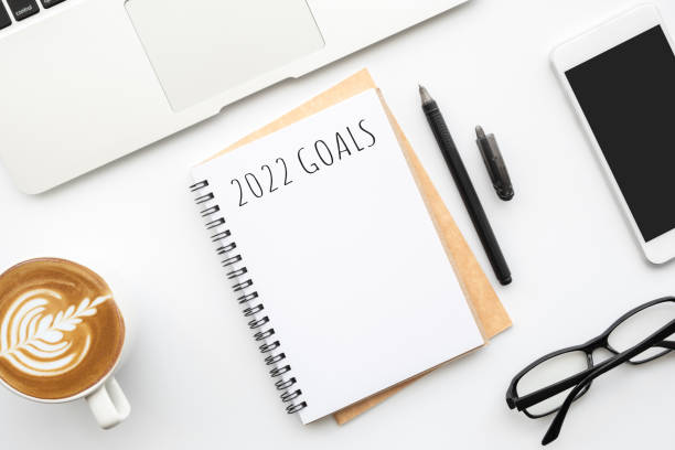 istock Notebook with 2022 goals text on it to apply new year resolutions and plan. 1354359310