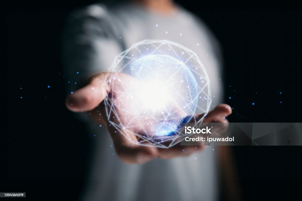 The concept of global media technology and the hands of a businessman carrying a world map. Domination Stock Photo