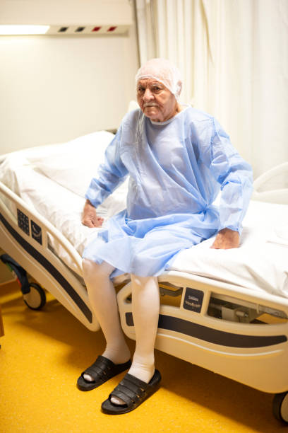 istock Elderly men is sitting on hospital bed before surgery 1354369515