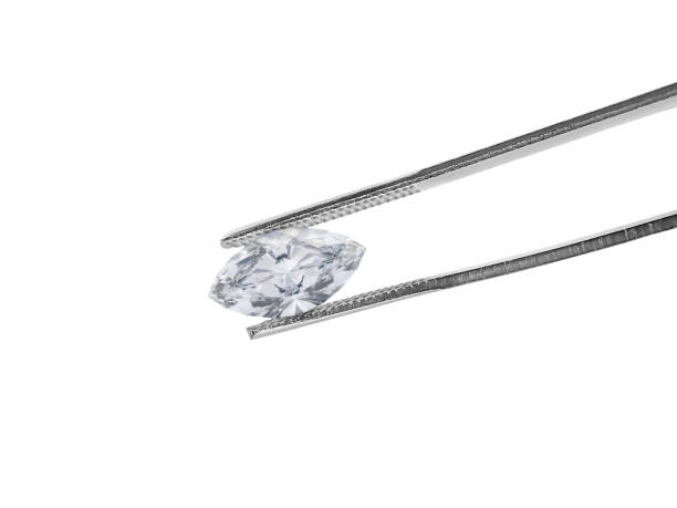 istock brilliant cut diamond held by tweezers isolated on white background 1354372882