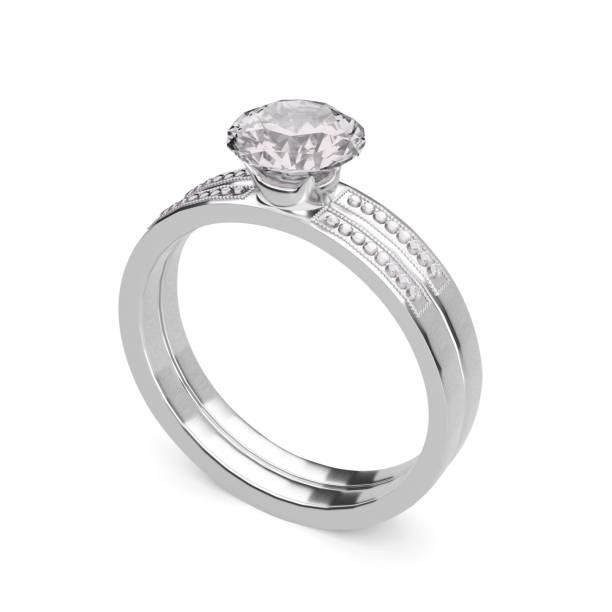 istock Close up of elegant diamond ring on white background. 1354376027