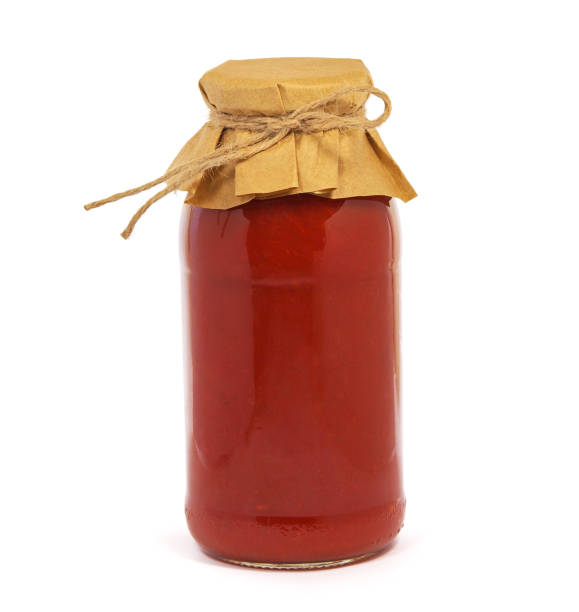 istock Jar of tomato paste isolated on white 1354381705