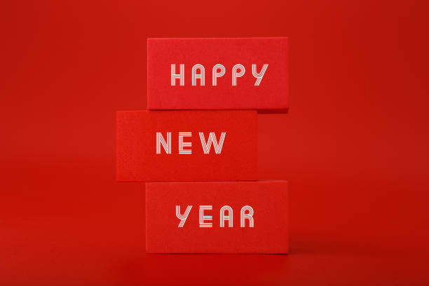 istock Happy New Year red elegant trendy minimal concept on red background. Stack of rectangles with text 1354382030