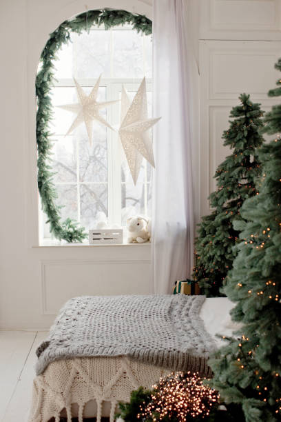 istock Christmas bedroom with Christmas decorations lights 1354382998