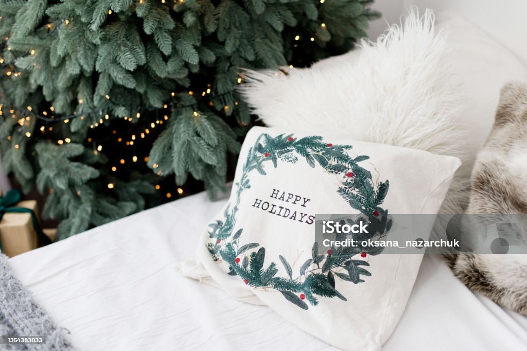 Christmas bedroom with Christmas decorations lights Christmas bedroom with Christmas trees, star decorations on a window and cozy Christmas lights Bed - Furniture Stock Photo