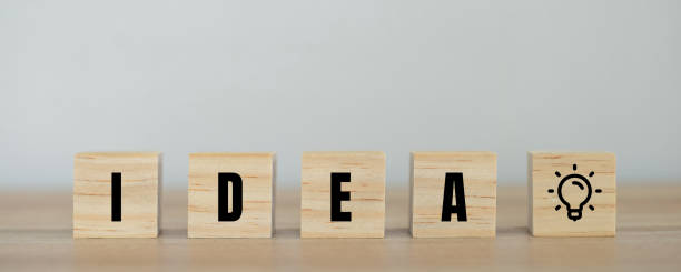 istock Wood cube the light bulb symbol represents the idea of creating various works on white background. 1354385847