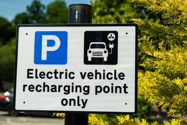 A sign indicating an electric vehicle recharging point or parking space in a car park stock photo