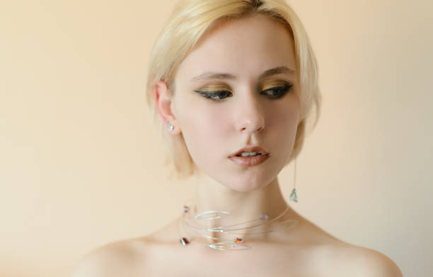 istock Beautiful young woman with blue eyes. 1354389981