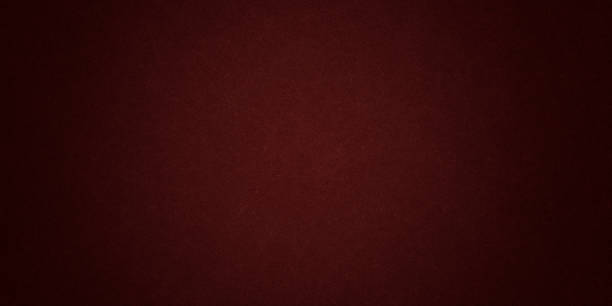 istock Dark red abstract grunge background color, light canter spotlight, faint orange vintage background 1354390702