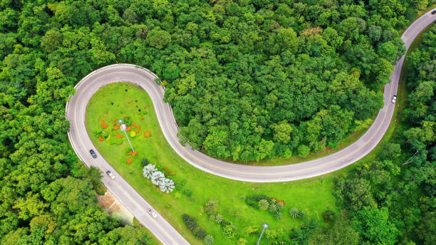 aerial top view of curve ping ngu, sakon nakhon province. winding road in the forest top view at ping ngu curve road sakon nakhon province, thailand. - twisty road imagens e fotografias de stock