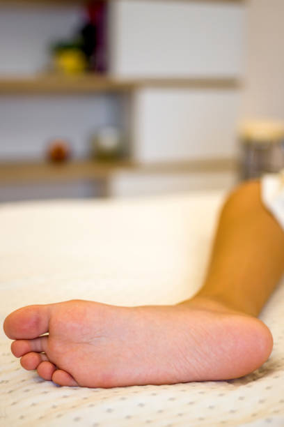istock Little girl performing flat feet exercises 1354392229