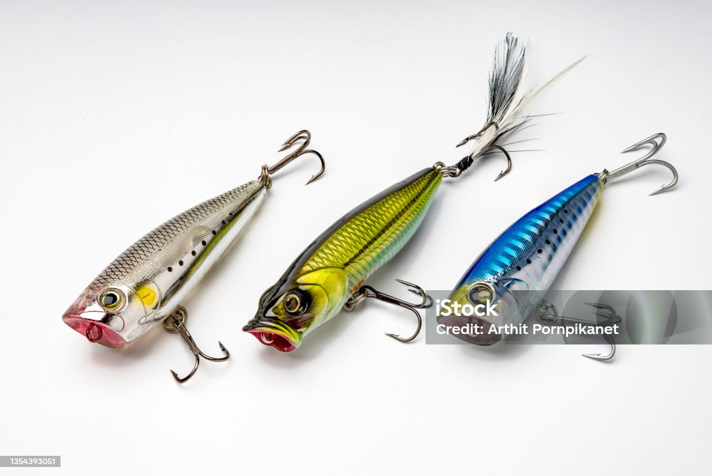 Artificial baits for catching of the predatory fishes on white background Fishing Hook Stock Photo