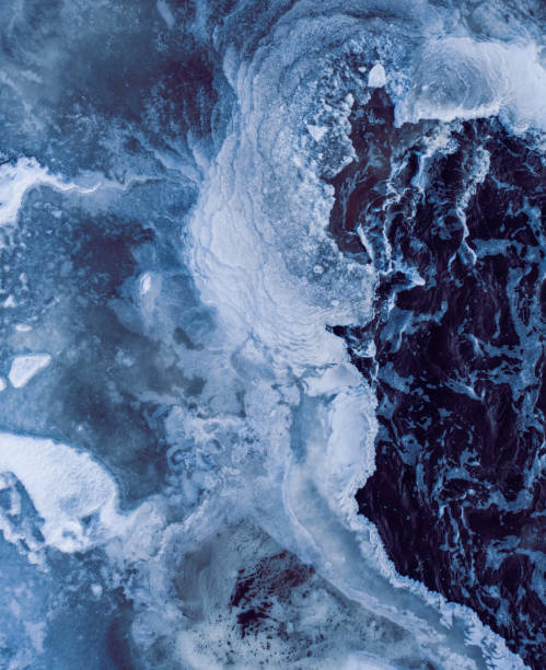 istock Winter waterfall with hole through icy build up from splash and spray 1354394303