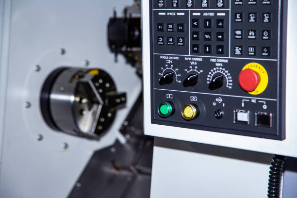 istock front view of cnc machine, control panel and working area of lathe 1354394461
