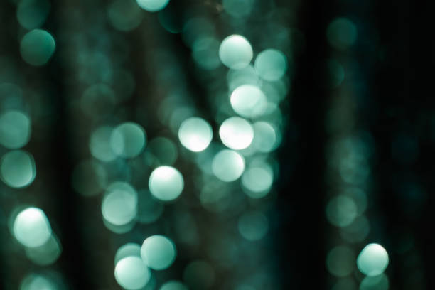 istock Abstract bokeh background of emerald green color. 1354394596