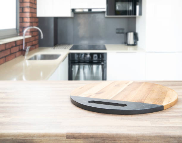istock Wood table top on blur kitchen room 1354394841
