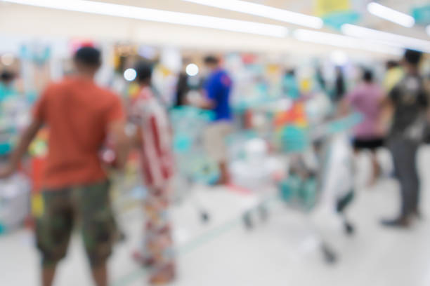 Blurred background, Customers line up a queue at cashier counter in supermarket Bangkok Thailand Blurred background, Customers line up a queue at cashier counter in supermarket Bangkok Thailand self checkout photos stock pictures, royalty-free photos & images