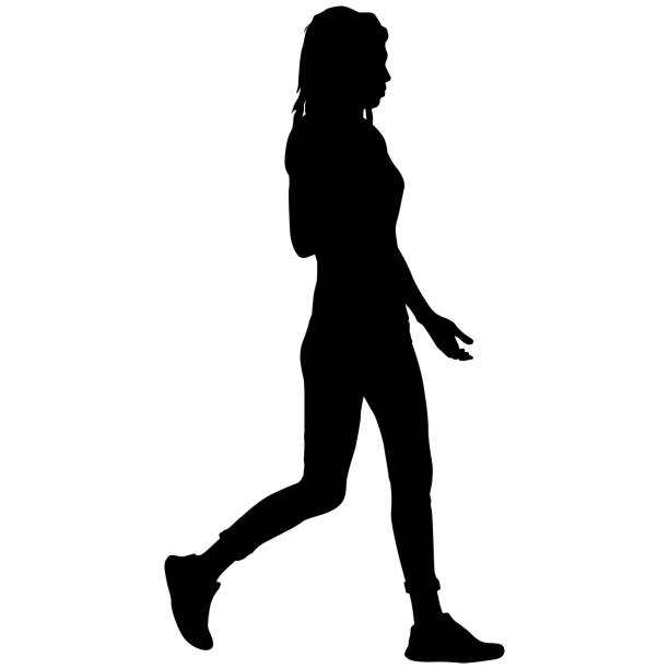 istock Silhouette of a walking women on a white background 1354396374