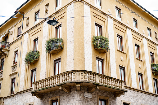 Old residential building with ivy-covered balconies in Bergamo. Italy. High quality photo