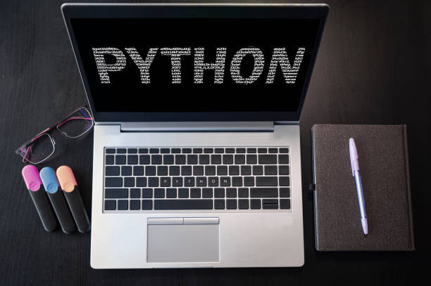 Top view of laptop with text python. Python inscription on laptop screen and keyboard. Learn python programming language, computer courses, training. python stock pictures, royalty-free photos & images