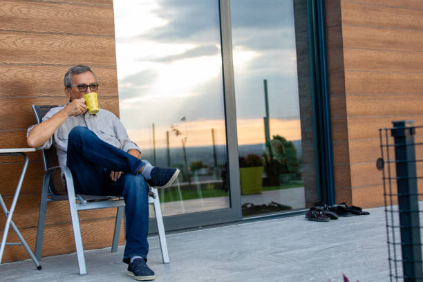 istock Mature Man Relaxing With a Cup of Coffee 1354397660