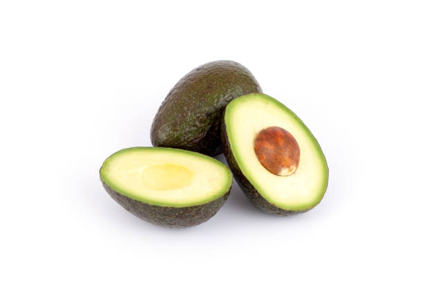 istock Fresh and ripe avocado whole and cut in half, healthy fruit isolated 1354400596