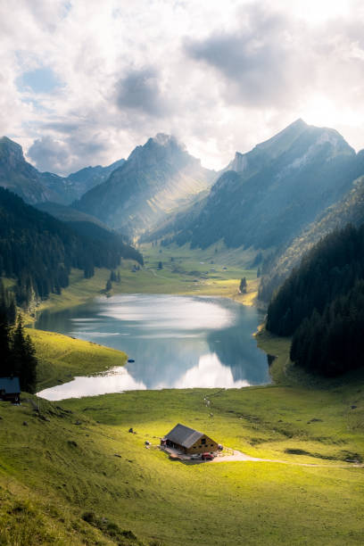 Appenzell views The view down on a mountain lake and a little farm appenzell stock pictures, royalty-free photos & images