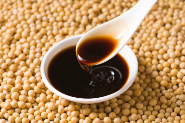 istock plate of soy sauce on soybean background 1354406054