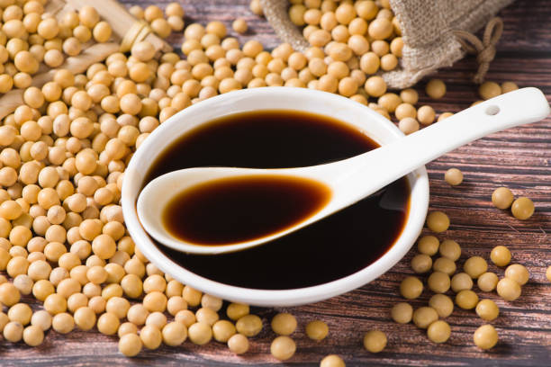 istock soy sauce and soybean on wooden background 1354406181