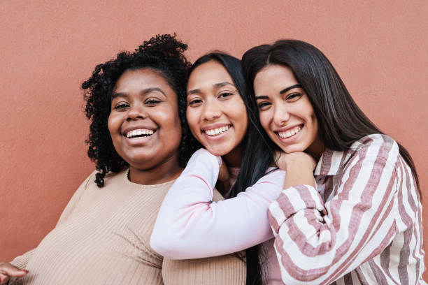 istock Multiracial friends having fun together outdoor - Focus on faces 1354406356