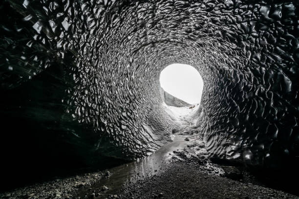 istock Dark blue glacier cave in Iceland 1354406992