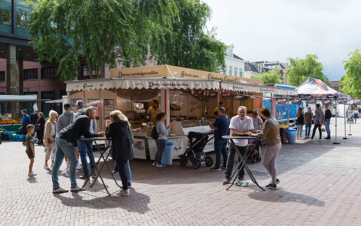 Leeuwarden, Friesland, Netherlands, august 6th 2021, people standing at a fish stall at the weekly market on the \