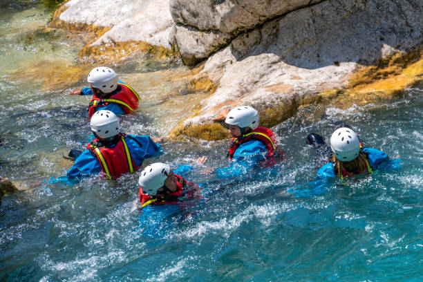 istock Group of people during canyoning in mountain gorge 1354408409