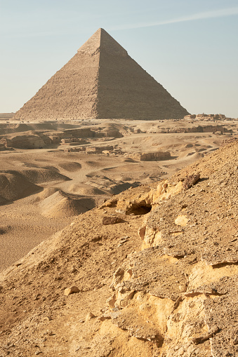 Giza pyramids and camel drivers at sunrise.