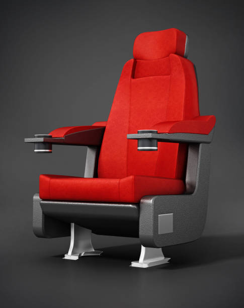 istock Red cinema chair standing on gray background 1354410120