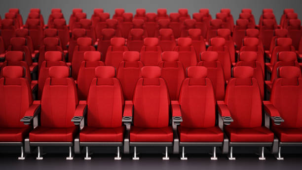 istock Group of red cinema chairs in a row 1354410297