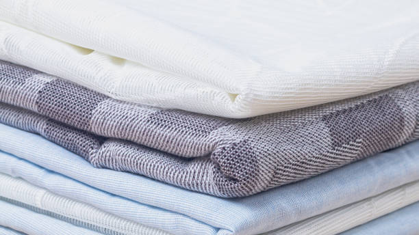 istock A stack of new fabric in white, gray, blue colors is neatly folded 1354410610