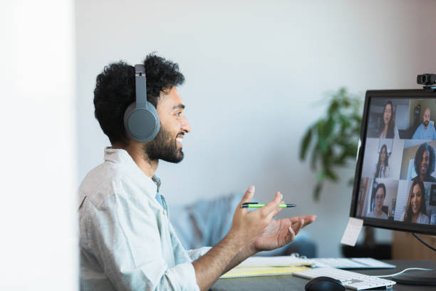 istock Man telecommutes from his home 1354411870