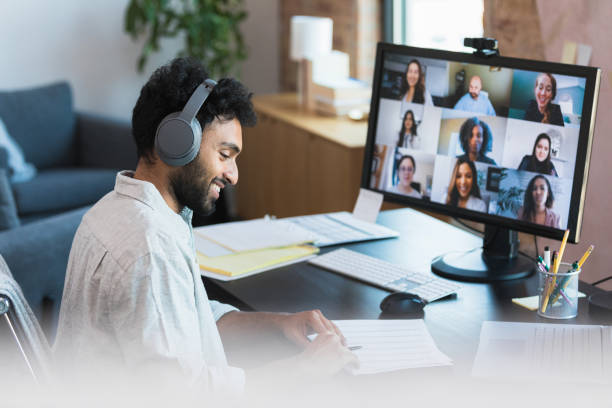 istock Businessman reviews spreadsheet during video call 1354411883