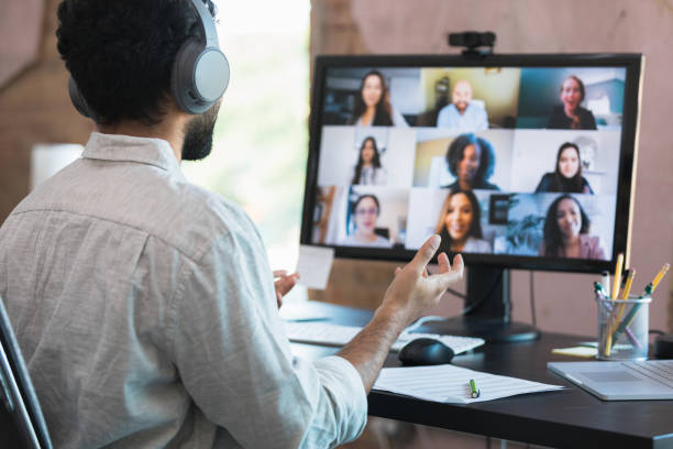 istock Businessman gestures during virtual meeting 1354411886