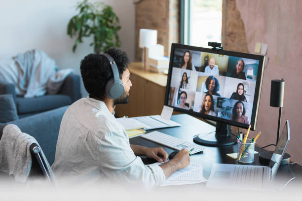 istock Attentive businessman attends video conference 1354411902