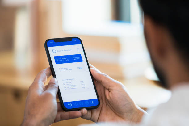 istock Man looks at checking account balance 1354411916