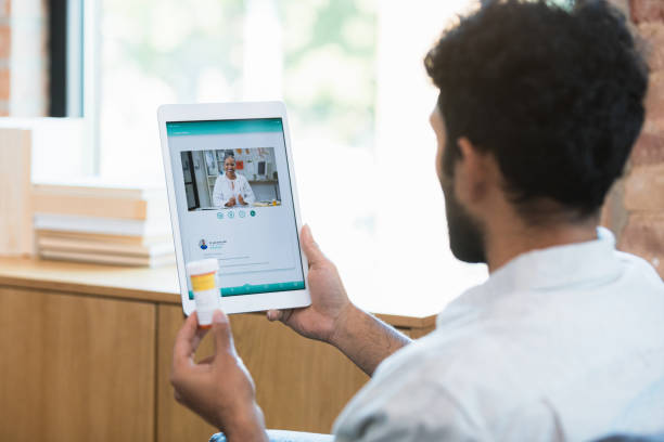 istock Doctor discusses medication with male patient 1354411919