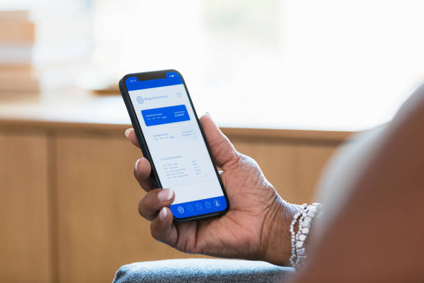 istock Unrecognizable woman uses mobile banking app 1354411926