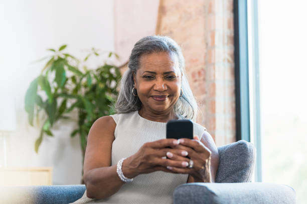 istock Senior woman sends text message 1354411936
